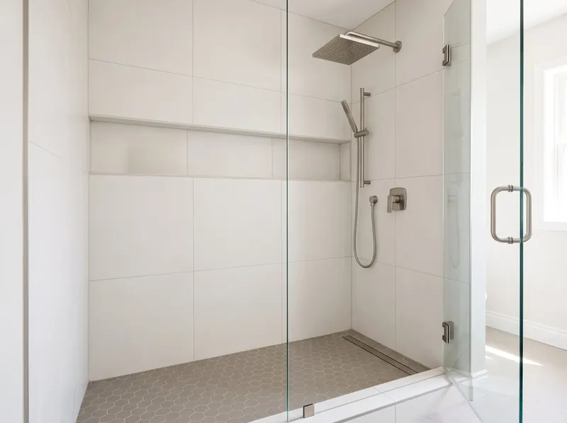 Design rendering of a large tile walk-in shower with a long wall niche and brushed nickel fixtures